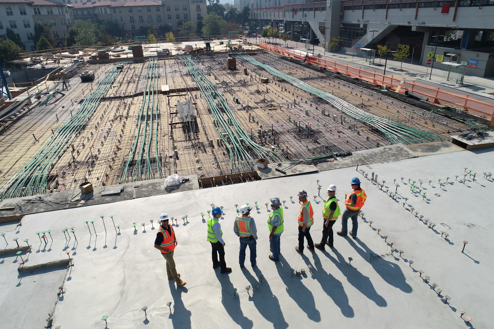 Project team reviewing works on a construction slab